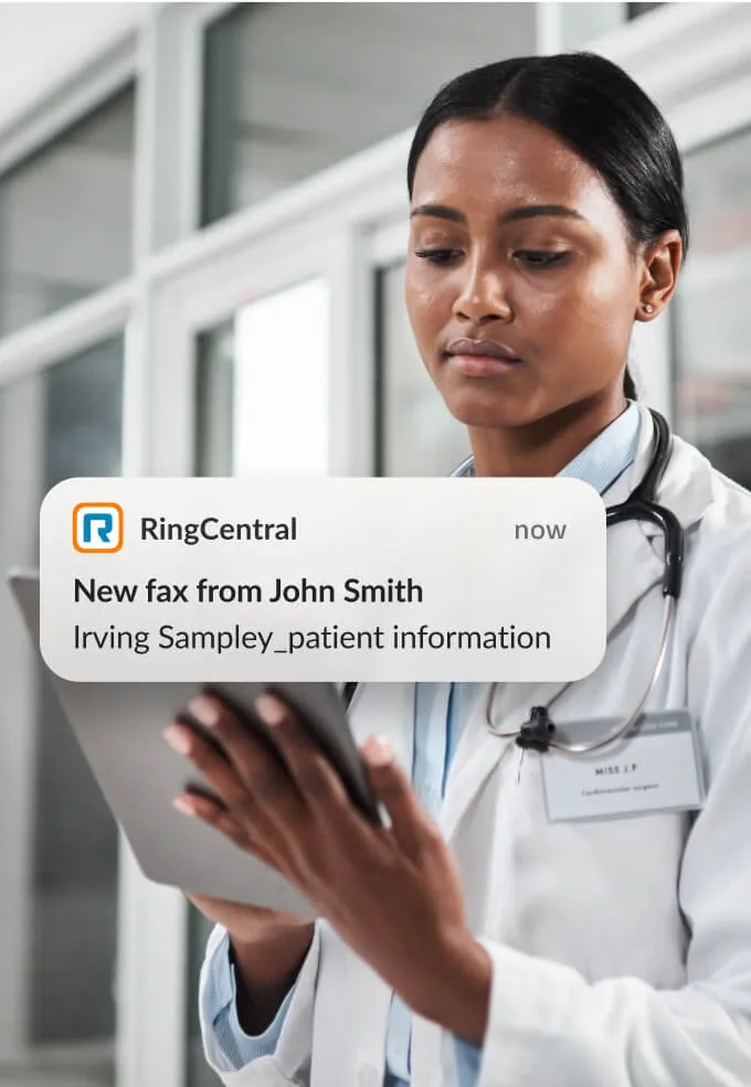 A female doctor receiving a patient's information via the RingCentral Fax on a tablet