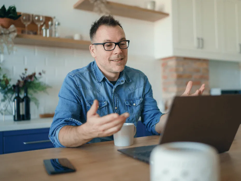 Manager using RingCentral Video to video chat with this remote team