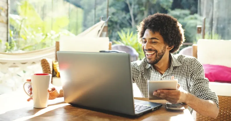 A man enjoying his day while working remotely.