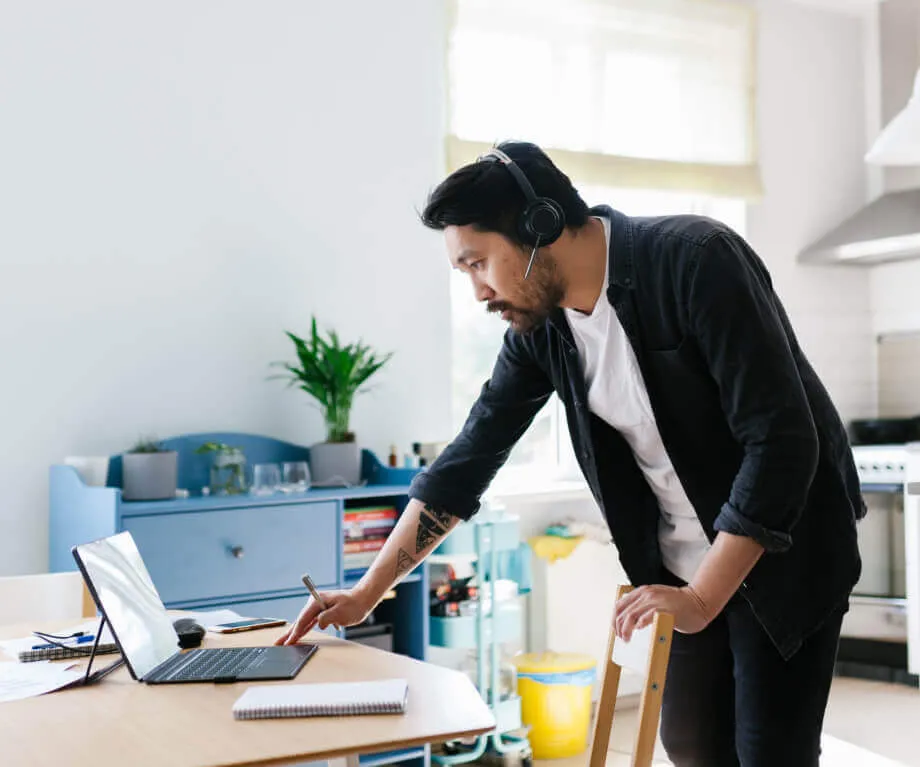 A working from home employee doing video call to his team mates