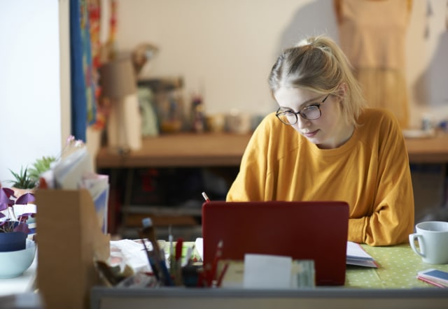 Female student at home studying.-422