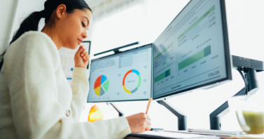 Woman with back pain working at standing desk home office-325