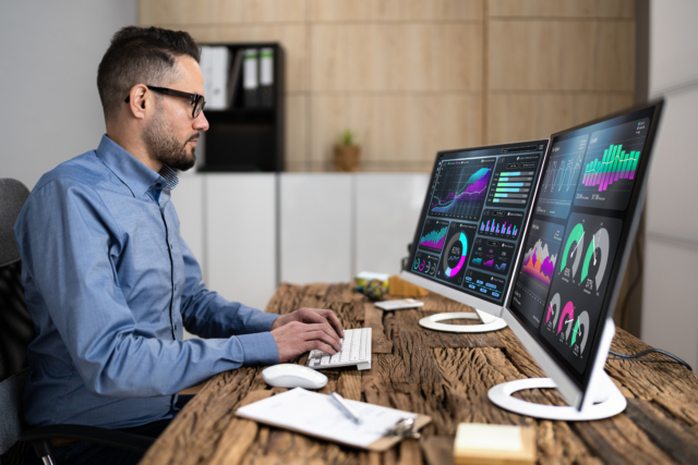 Man Working with Dual Monitors