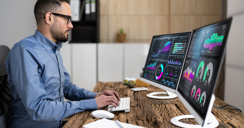 Man Working with Dual Monitors