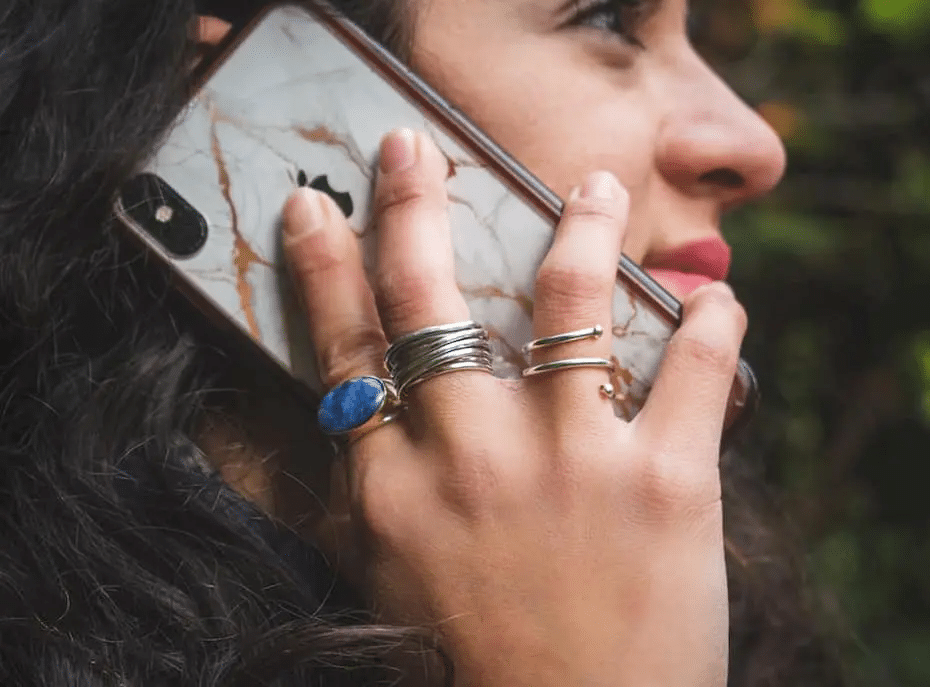 A woman makes a call on her cell phone—perhaps using a Google Voice alternative