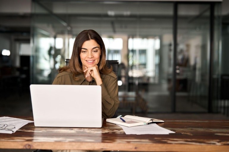 thoughtful woman working at her desk