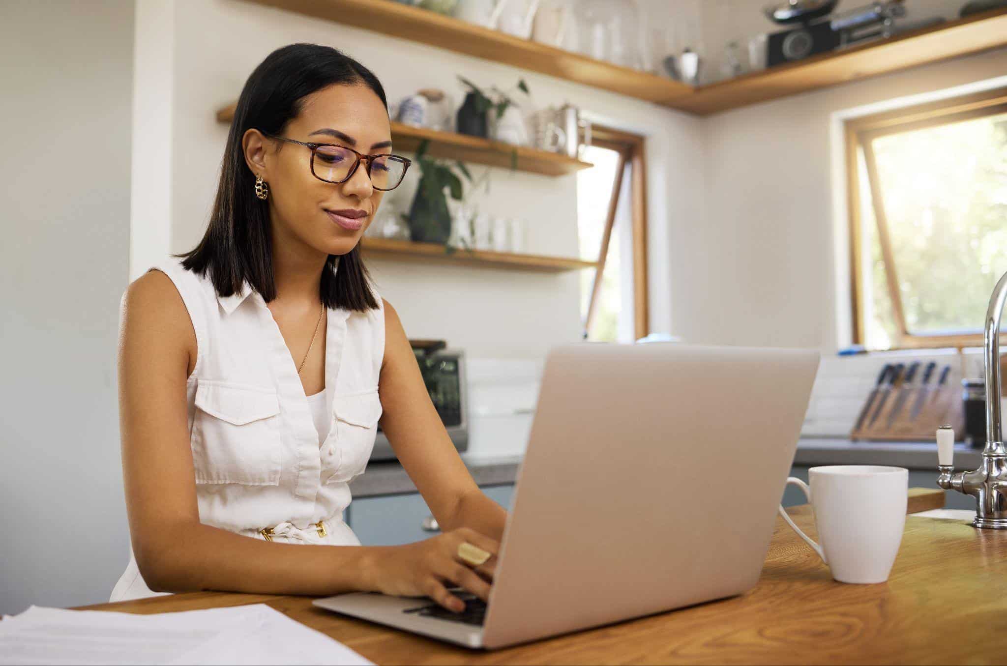 Professional leveraging AI for personal productivity, working from a cozy kitchen space